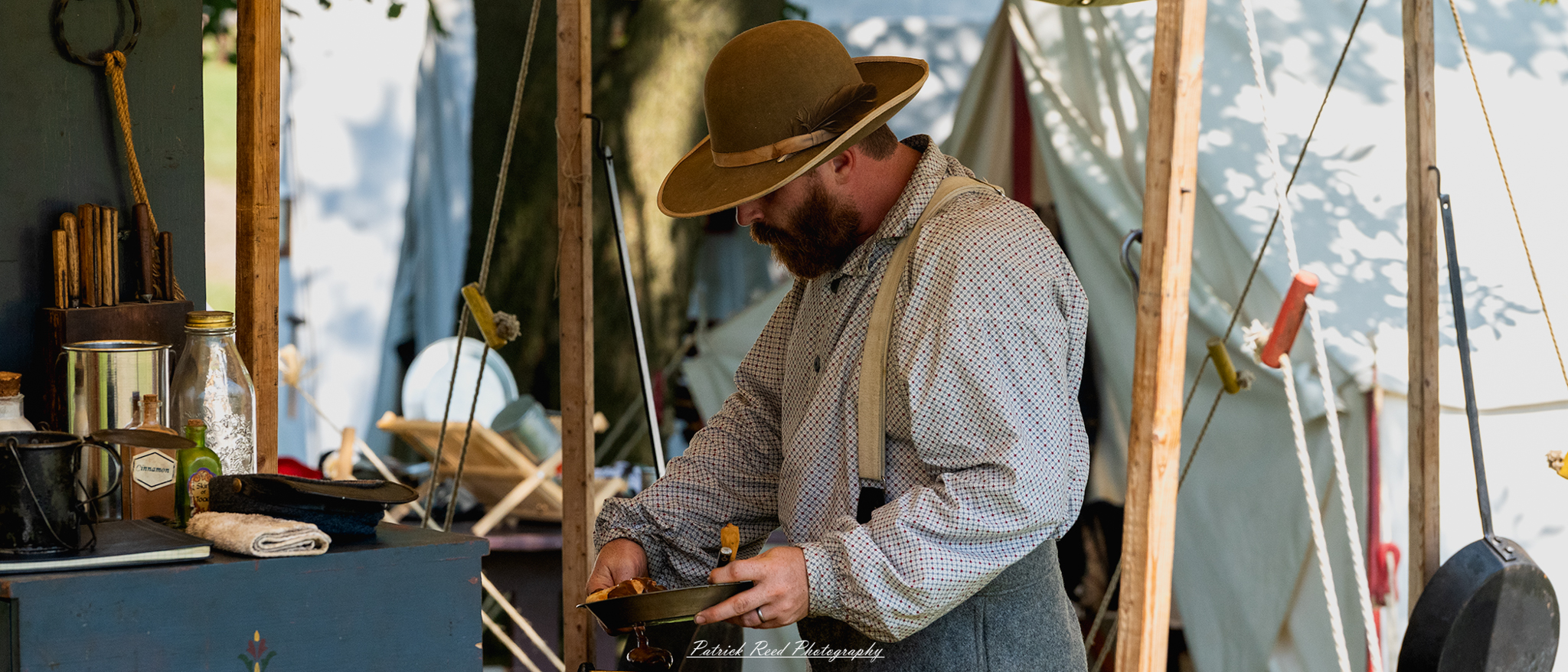 A man in period clothing, standing while enjoying a meal. Dressed in attire typical of his era, such as a waistcoat and trousers, he holds a plate or bowl in one hand, exuding a sense of satisfaction. The scene captures the essence of everyday life in that period, showcasing the simple pleasures of food and companionship.